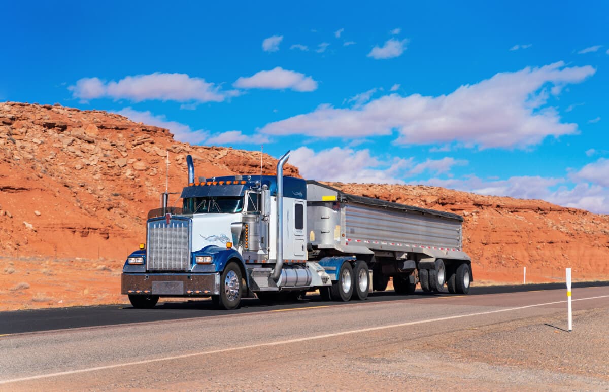 dump-truck-on-rural-road-dump-truck-insurance.jpg