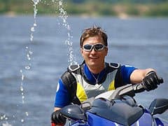 A man riding a jetski.